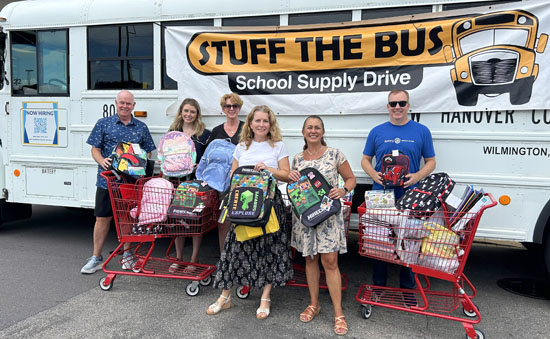 Rotarians donate school supplies through 'Stuff the Bus' project